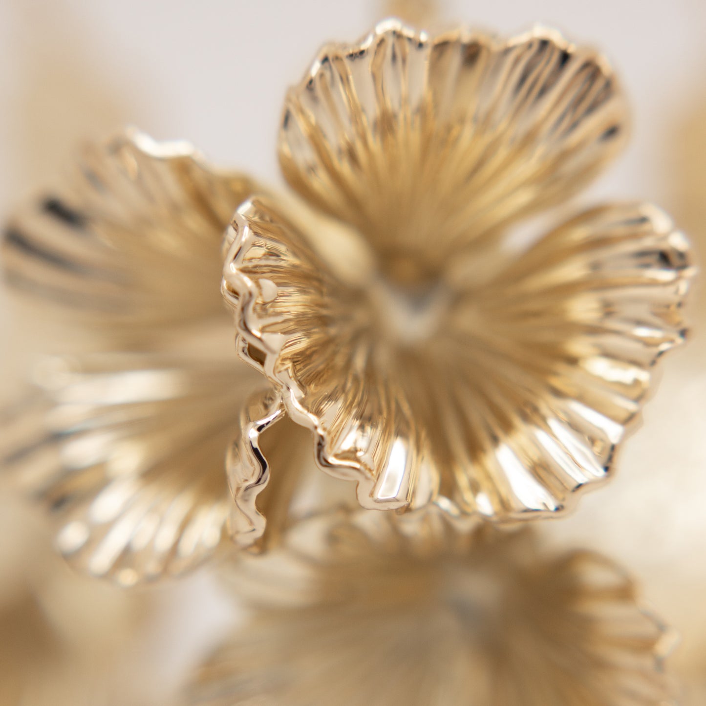 Large gold floral hoop earrings