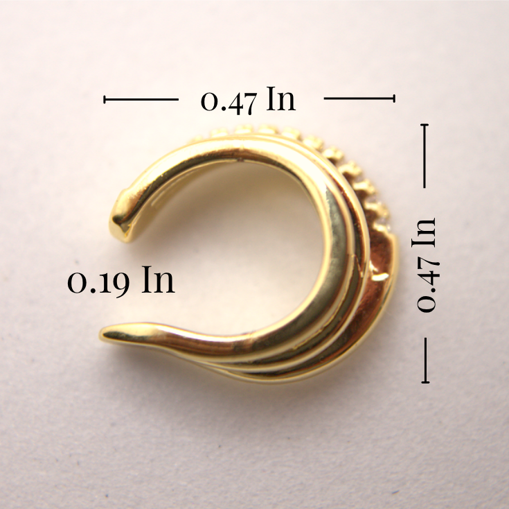 Gold spiral earring with measurements on a light gray background