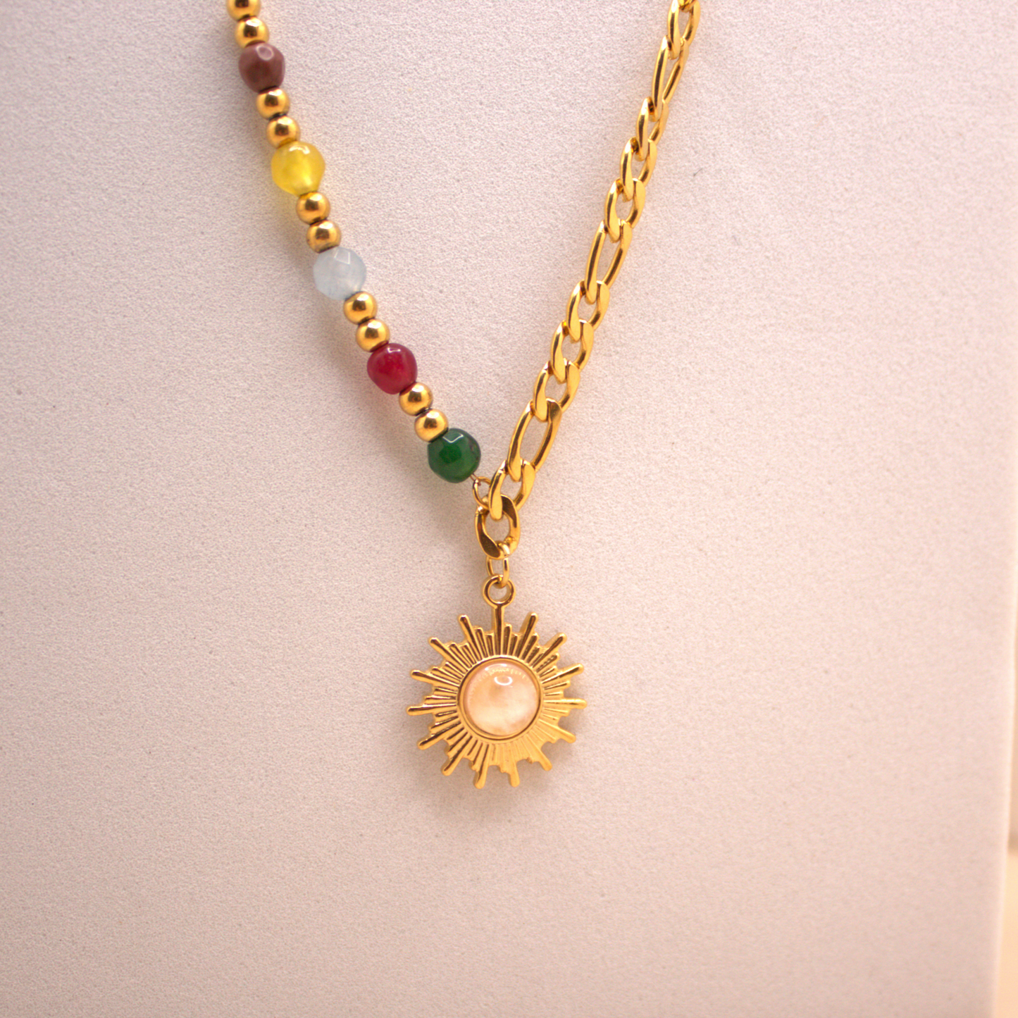 Minimalist gold sun necklace, stainless steel with colorful bead details, waterproof design.