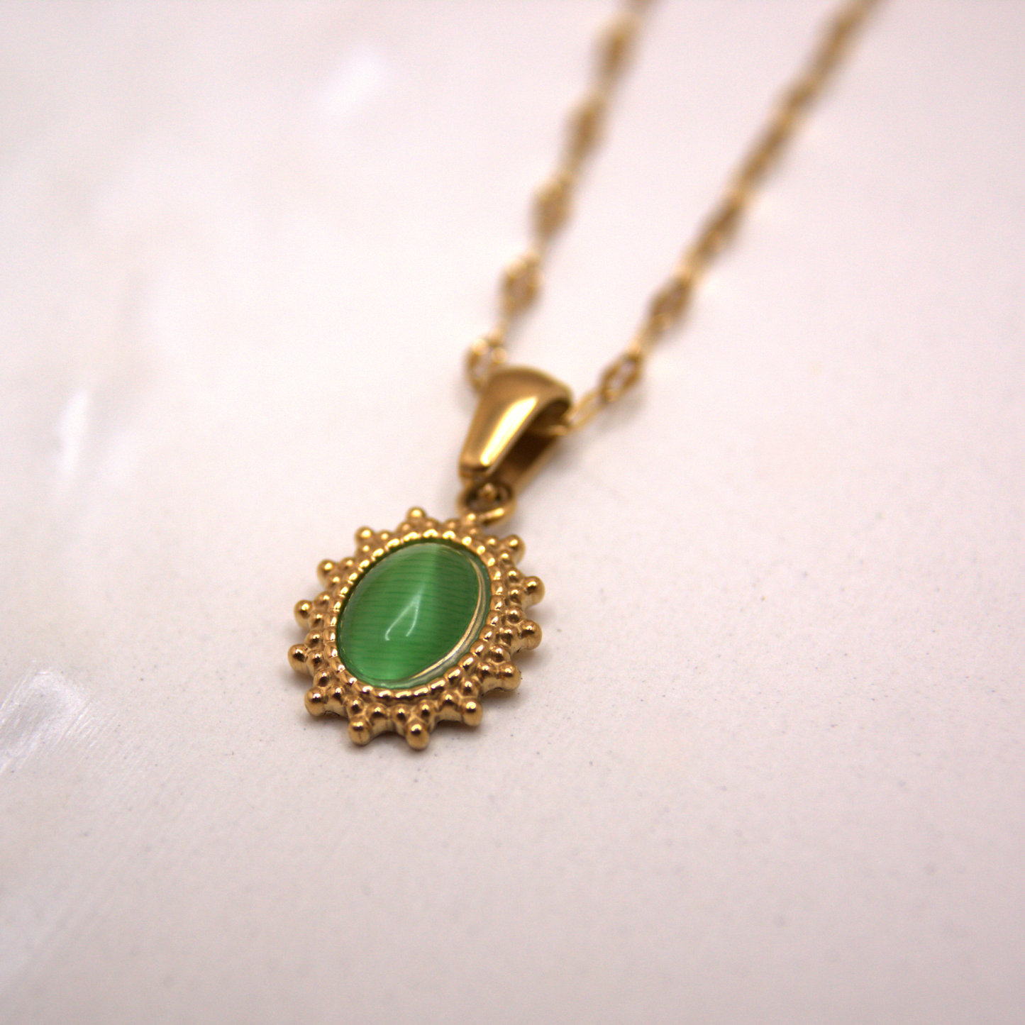 Boho chic gold pendant necklace, delicate chain with small green gemstone.