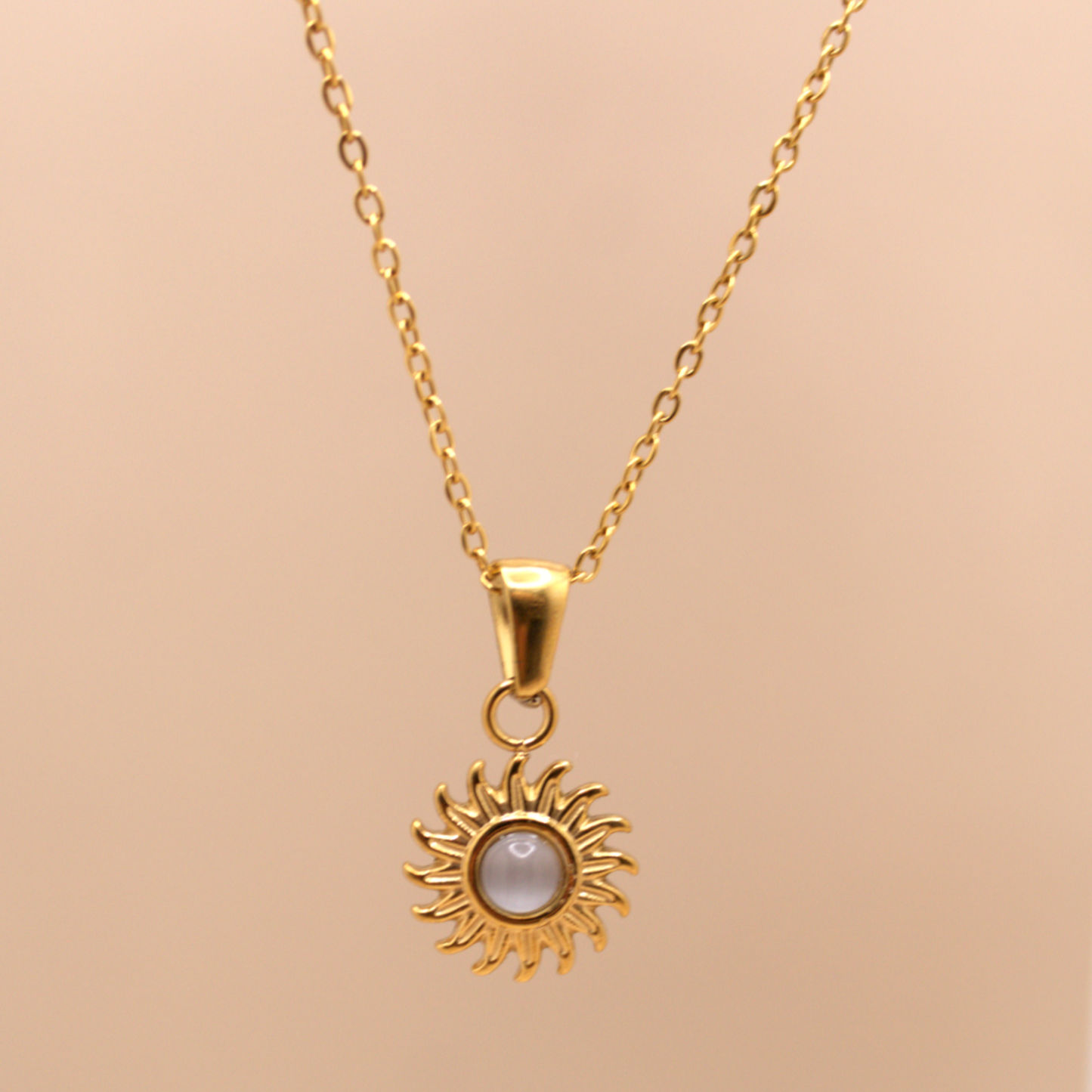 Small gold sun charm necklace, stainless steel waterproof design with delicate chain.