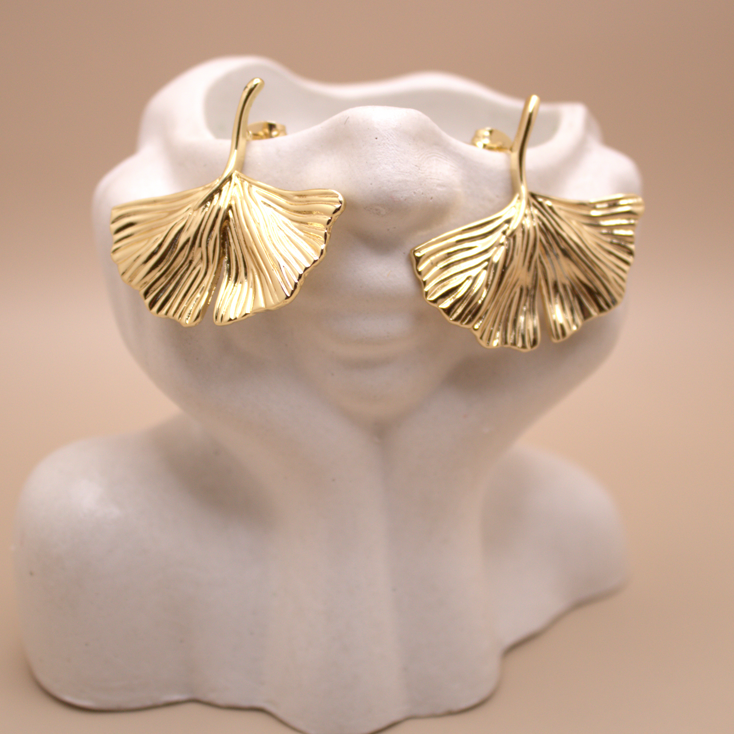 Elegant gold earrings inspired by ocean breeze and coastal beauty.
