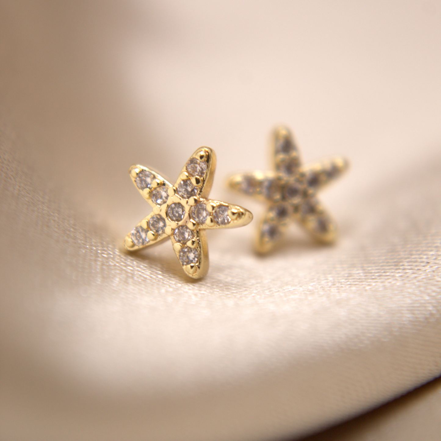 Shiny golden starfish earrings, waterproof and hypoallergenic.