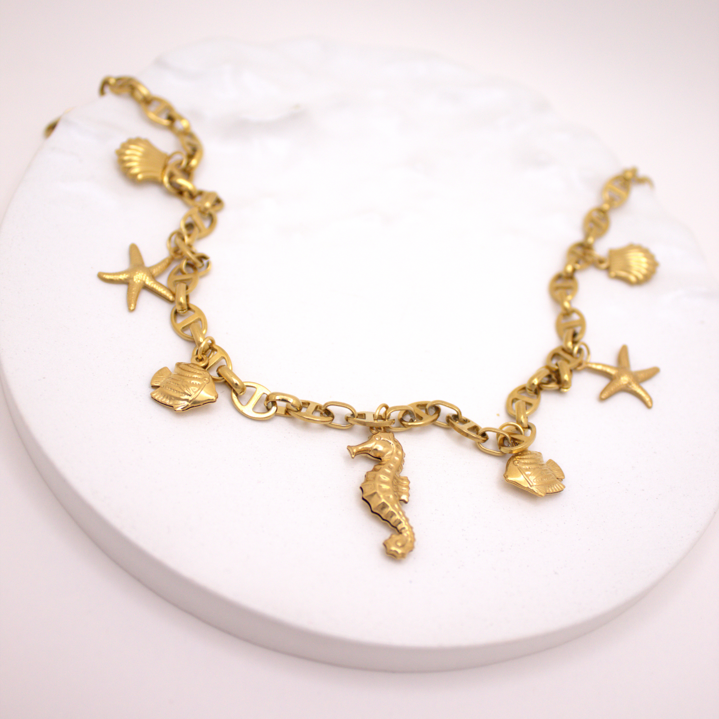 Ocean-inspired multicharm necklace in waterproof PVD gold