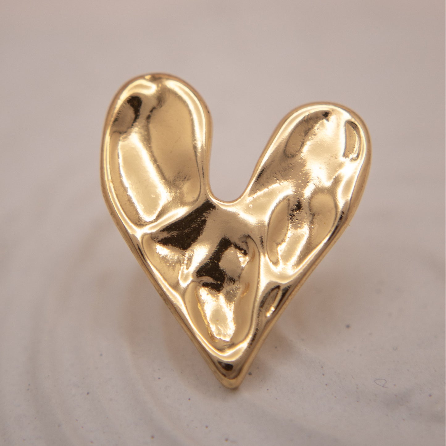 Liquid Heart gold stud earrings with modern sculpted texture