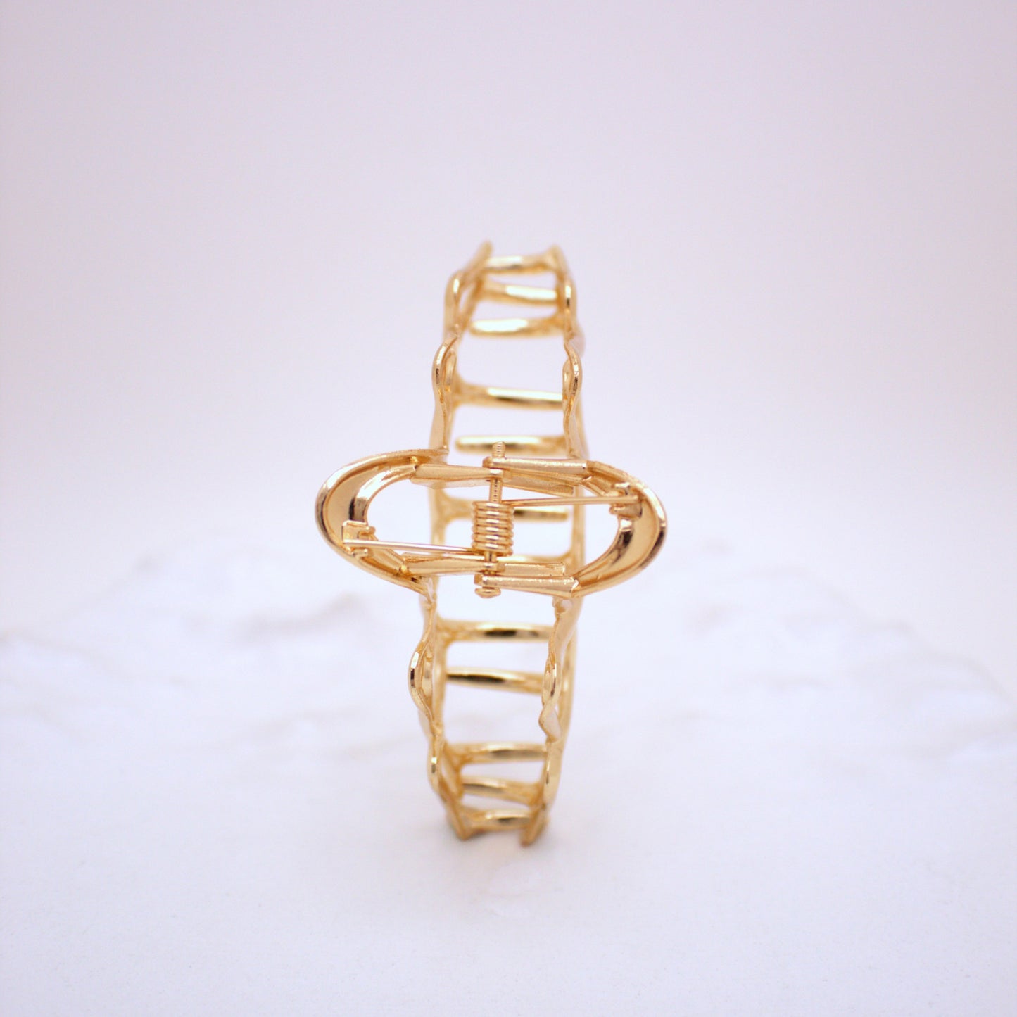 Gold bracelet on a white background