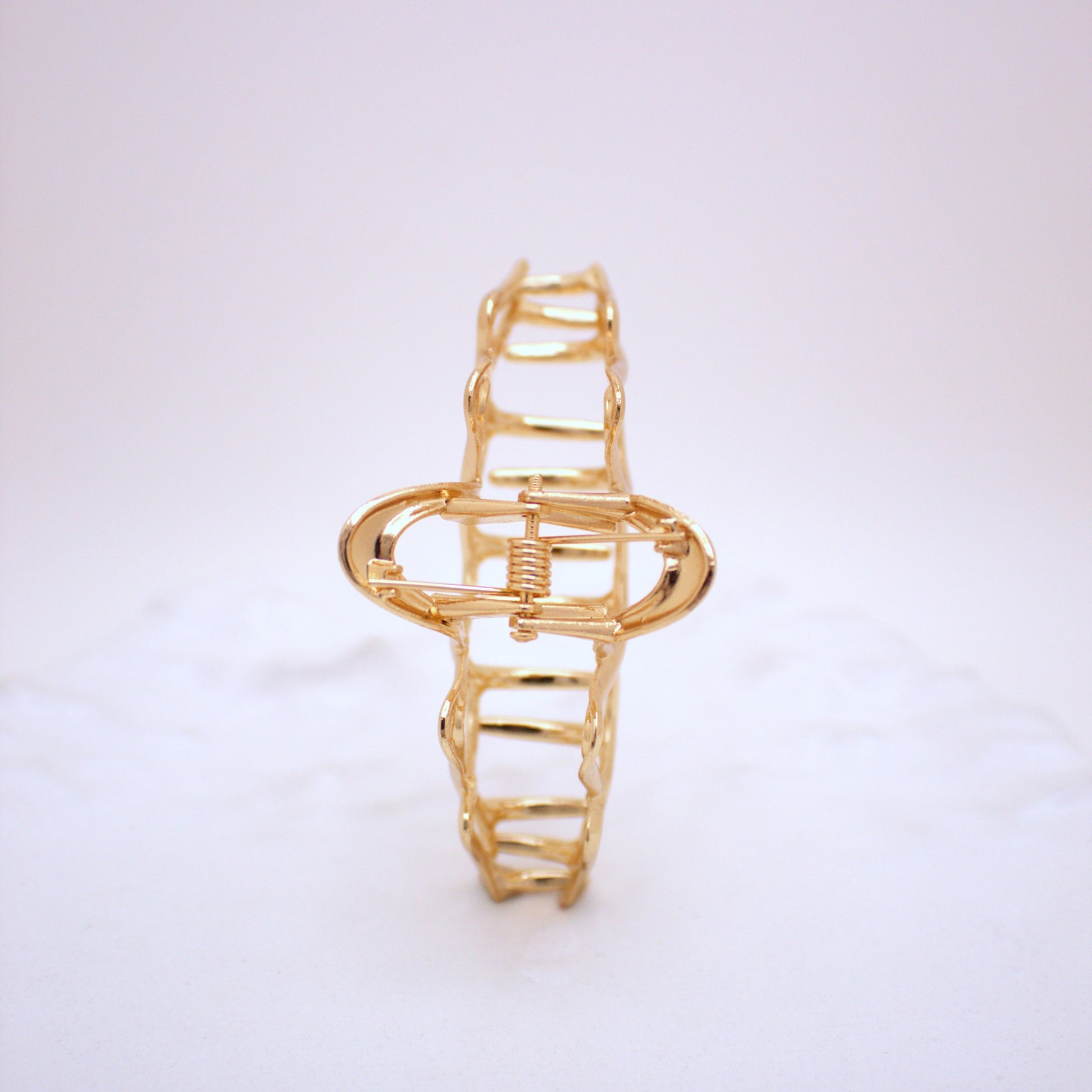 Gold bracelet on a white background