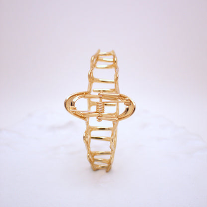 Gold bracelet on a white background