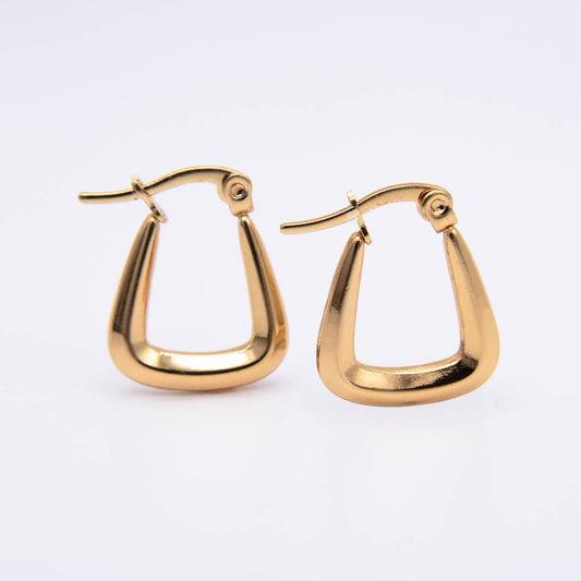 A pair of gold-toned geometric hoop earrings with a curved, open triangular design, displayed on a clean white background.