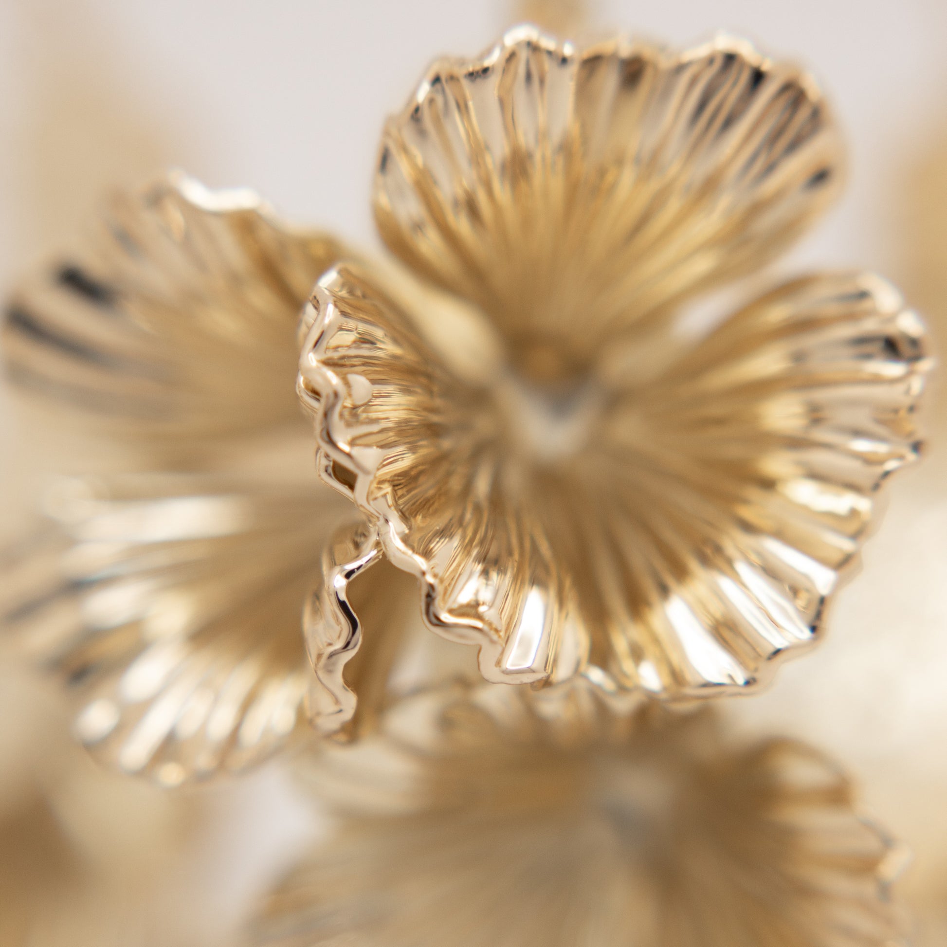 Large gold floral hoop earrings
