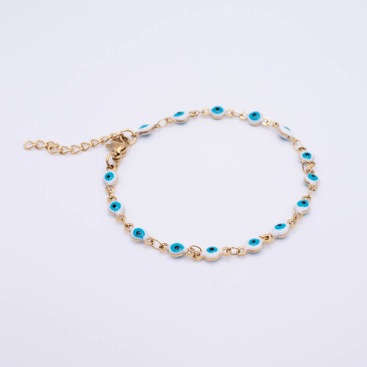 Gold chain bracelet with multiple evil eye charms featuring turquoise blue centers and white borders, displayed on a clean white background.