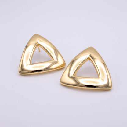 A pair of gold triangular stud earrings with an open center design, displayed on a clean light gray background.