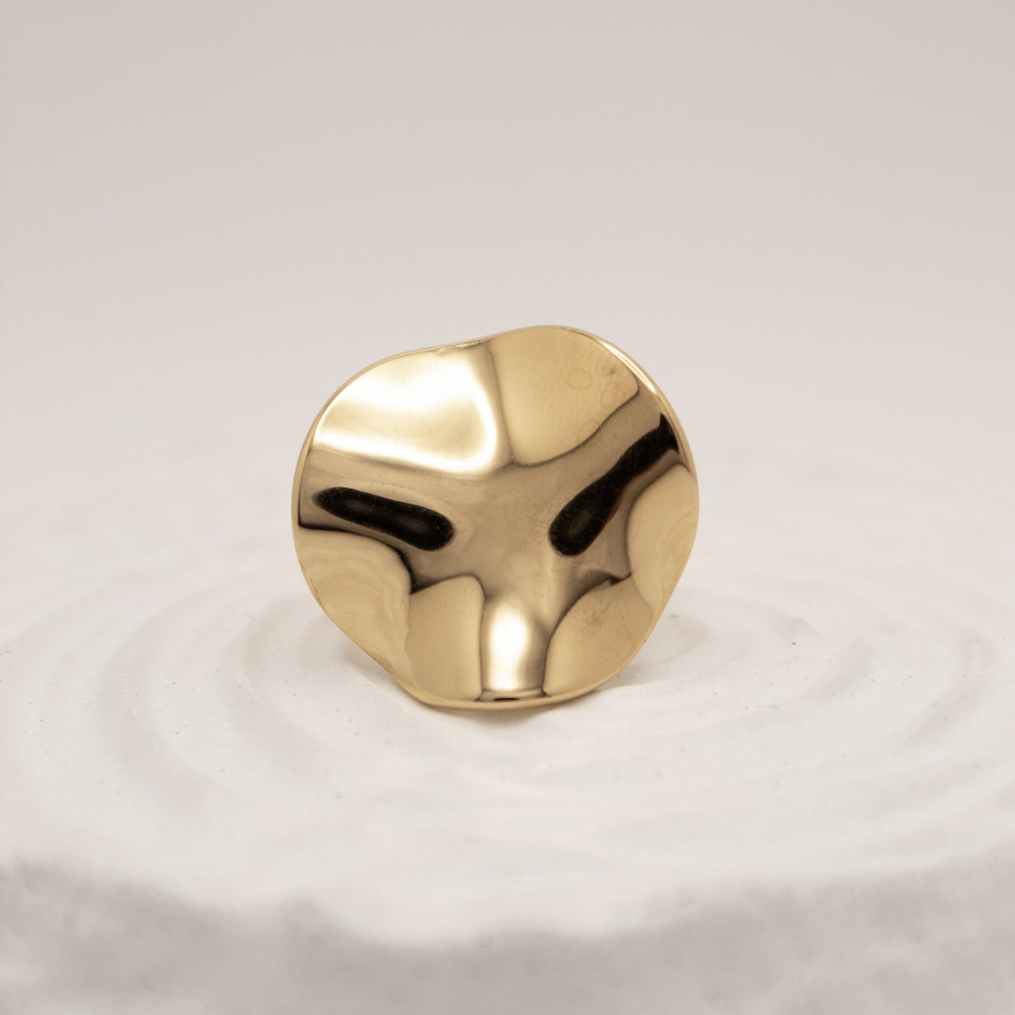 Gold knob on a white background