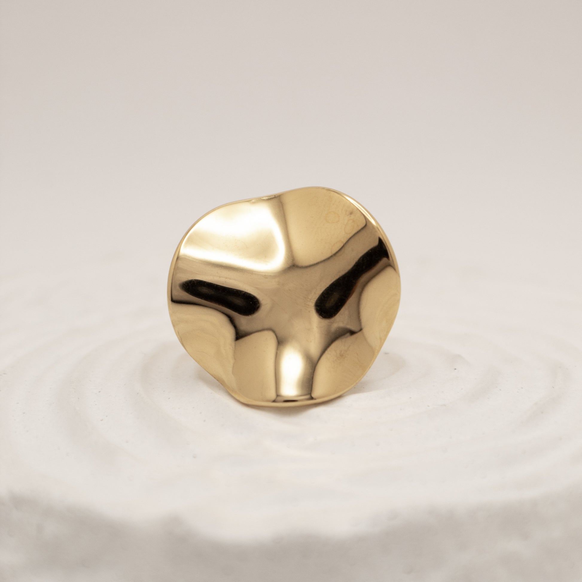 Gold knob on a white background