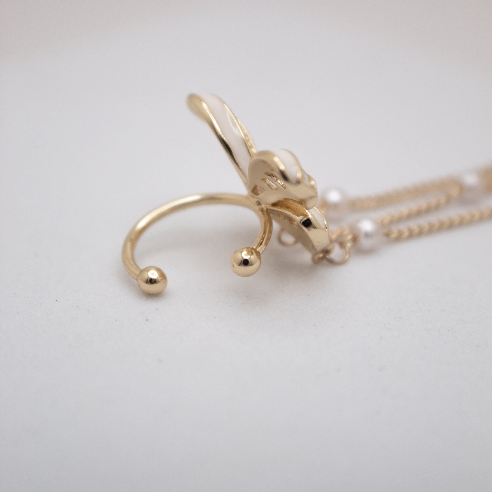 Elegant butterfly ear cuff with pearl chains