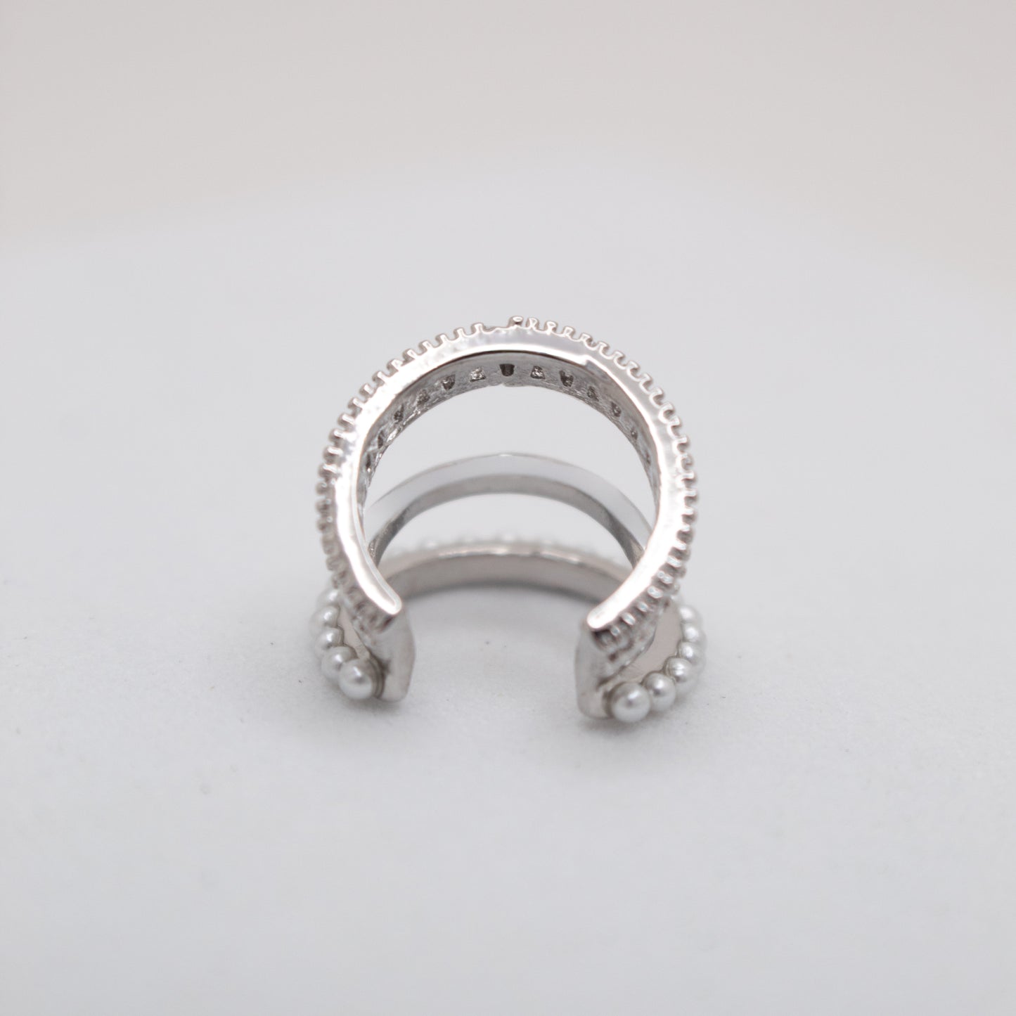 Elegant silver ear cuff with shiny crystals