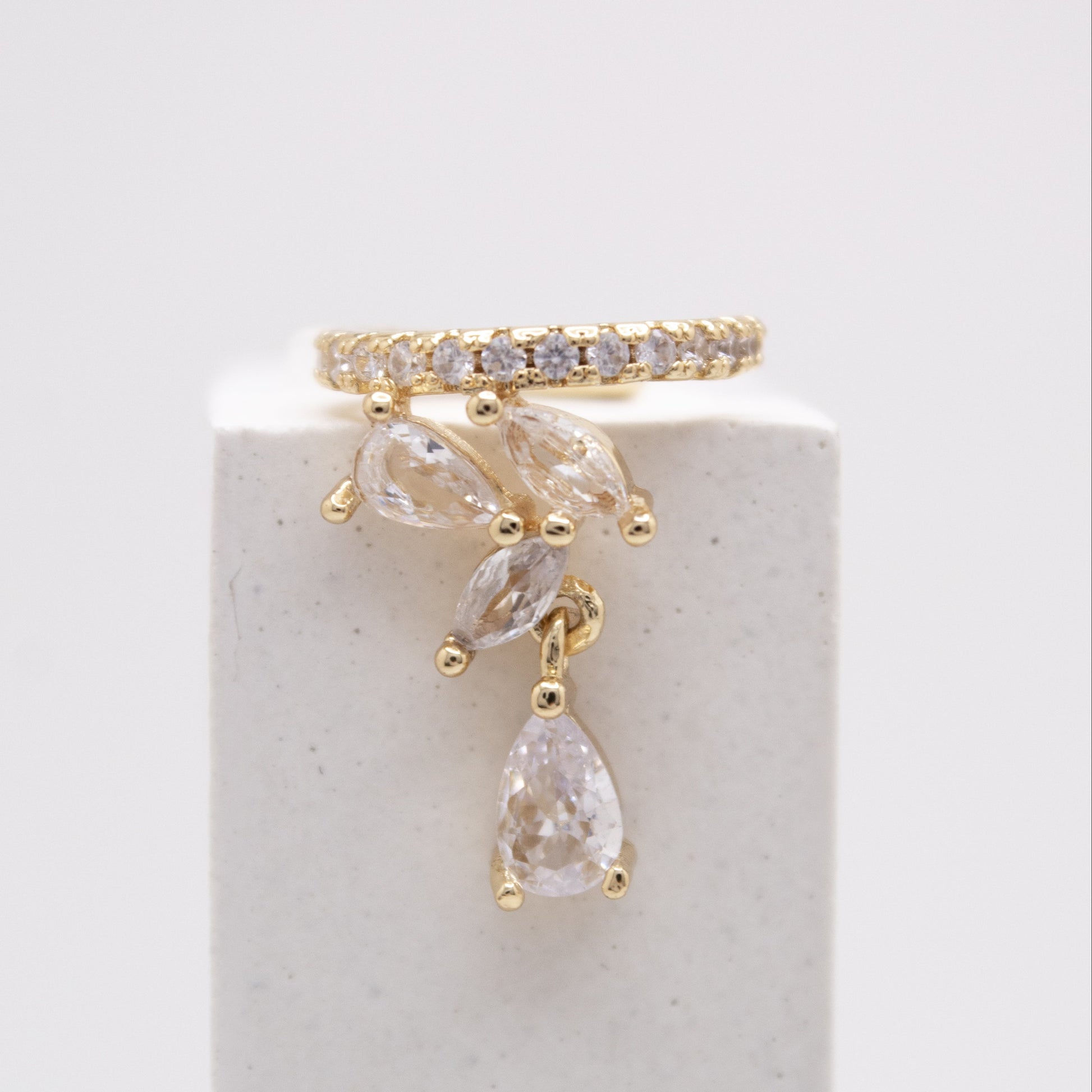 Golden ear cuff with crystal drop pendant