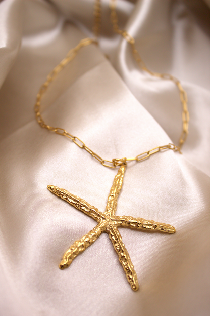Adjustable gold link chain necklace with bold starfish pendant
