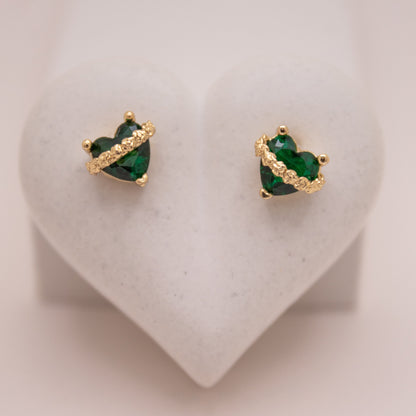 Gold heart stud earrings with green crystal