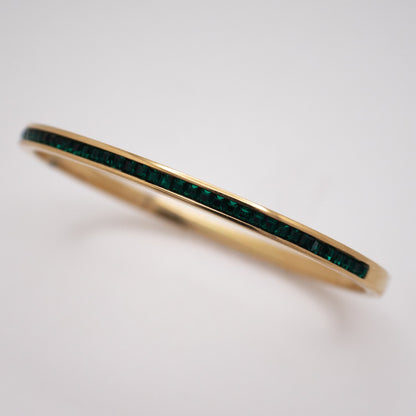 Golden bangle with emerald crystal line in PVD stainless steel