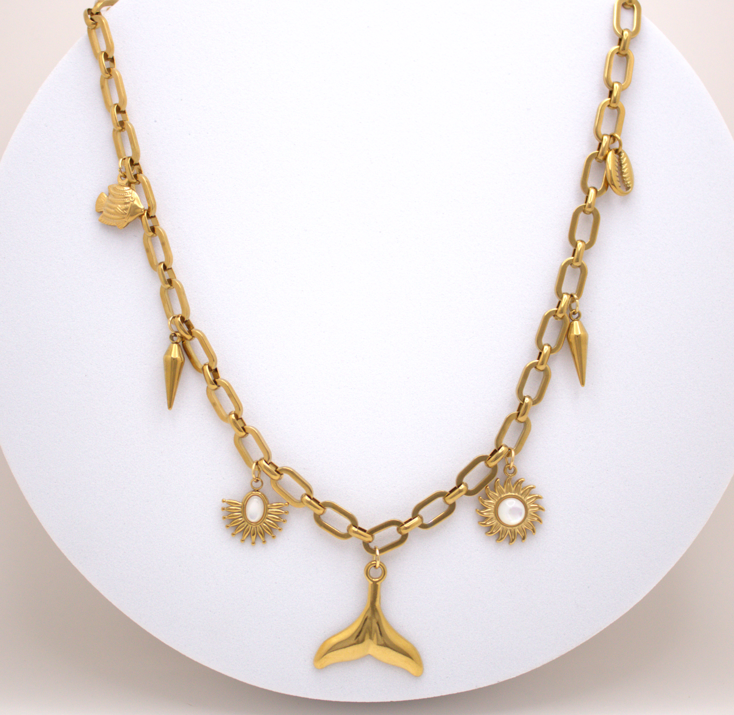 Gold waterproof necklace with sun and shell charms by Selva&Co