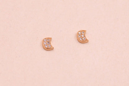 Mini gold moon stud earrings with white cubic zirconia stones, dainty and elegant design.