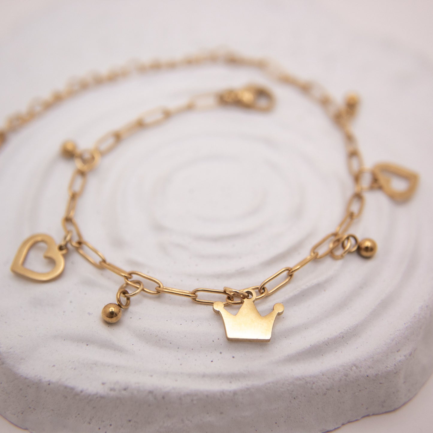 Royal Heart gold bracelet with heart charms and crown accent