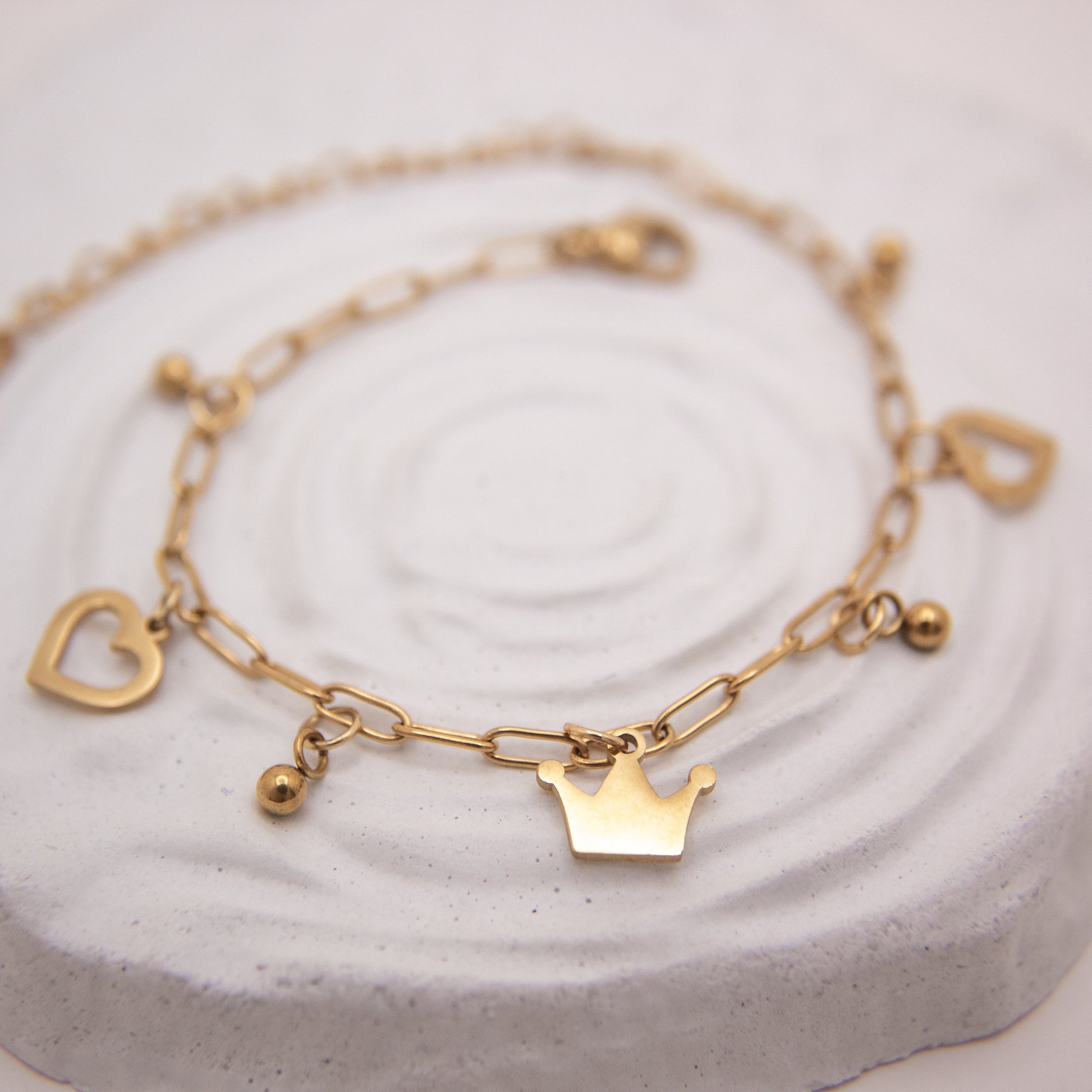 Royal Heart gold bracelet with heart charms and crown accent