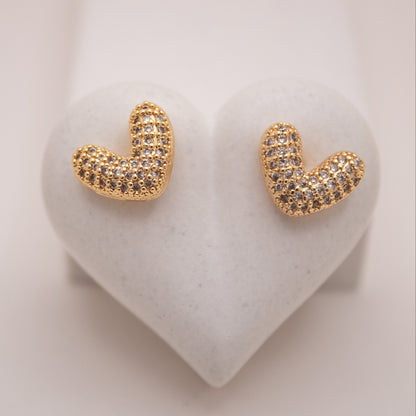 Gold heart stud earrings with high-shine finish by Selva&Co.
