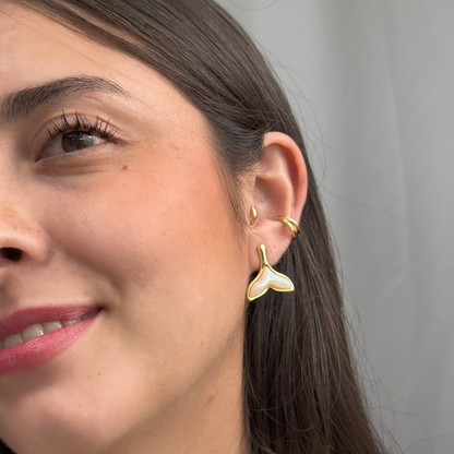 Mermaid-inspired gold earrings with waterproof and hypoallergenic design.