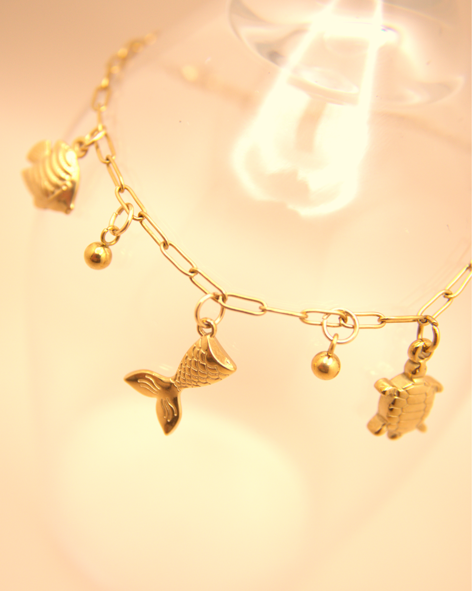 Ocean-inspired gold stainless steel bracelet with mermaid tail charm