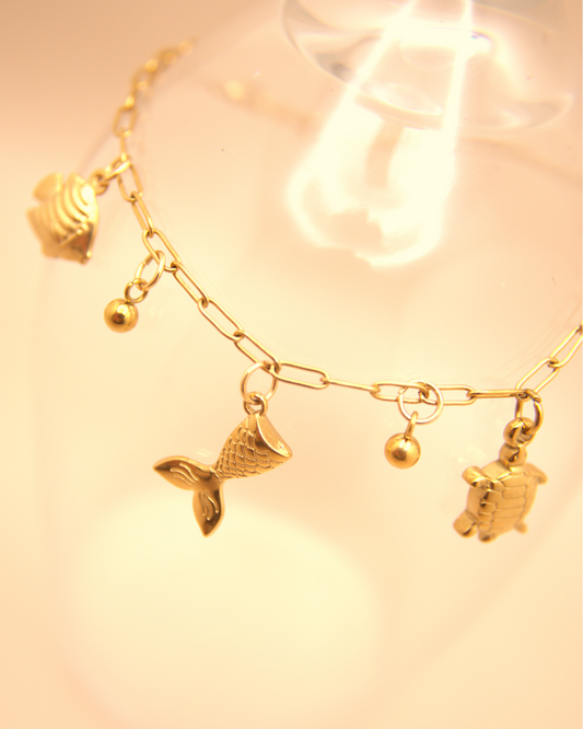 Ocean-inspired gold stainless steel bracelet with mermaid tail charm