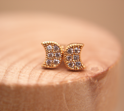 Tiny crescent moon earrings, gold studs with sparkling zirconia, minimalist jewelry.