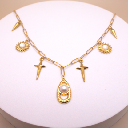 Chunky link chain necklace with mixed charms in gold PVD stainless steel.