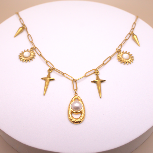 Chunky link chain necklace with mixed charms in gold PVD stainless steel.