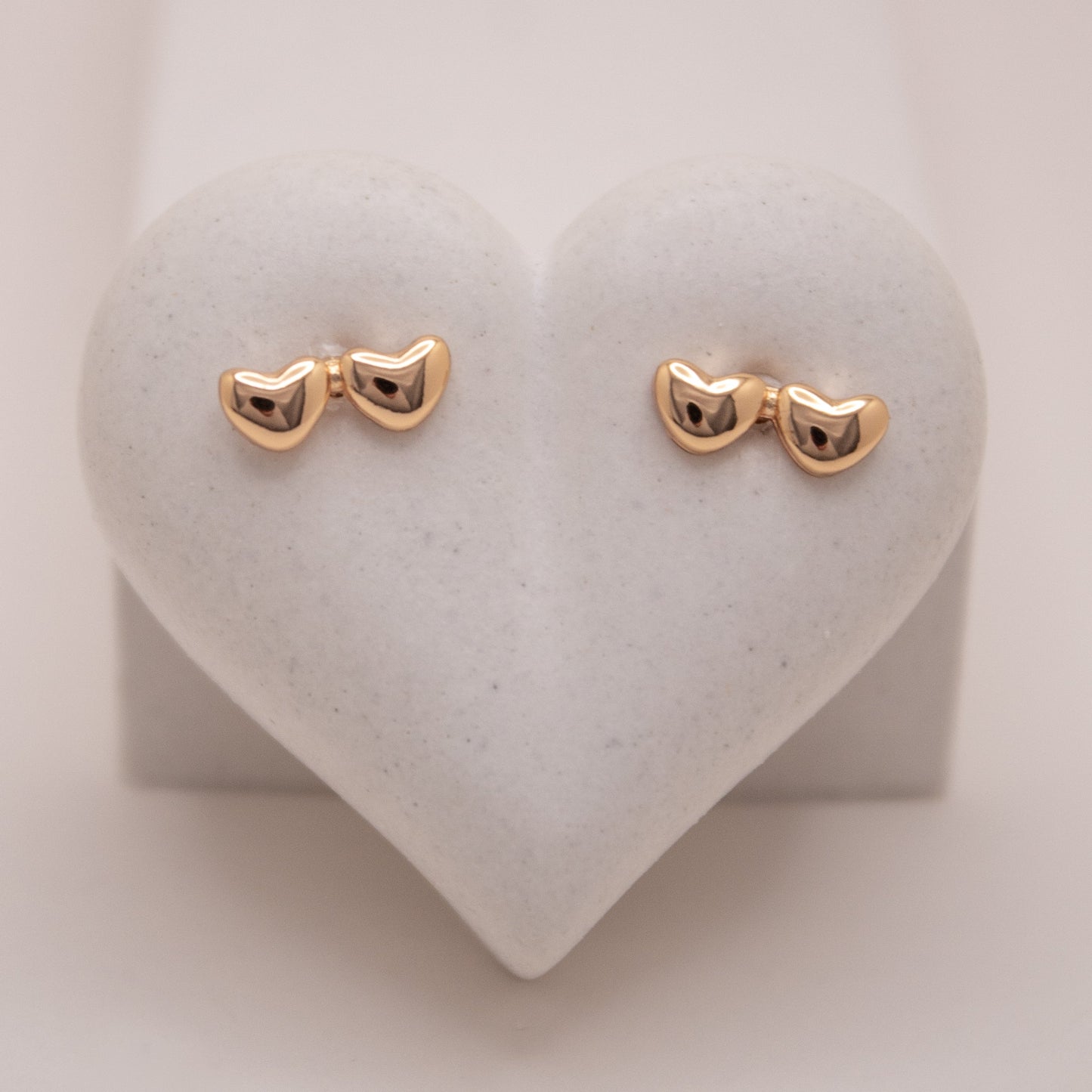 Gold rose stud earrings with double heart design by Selva&Co.
