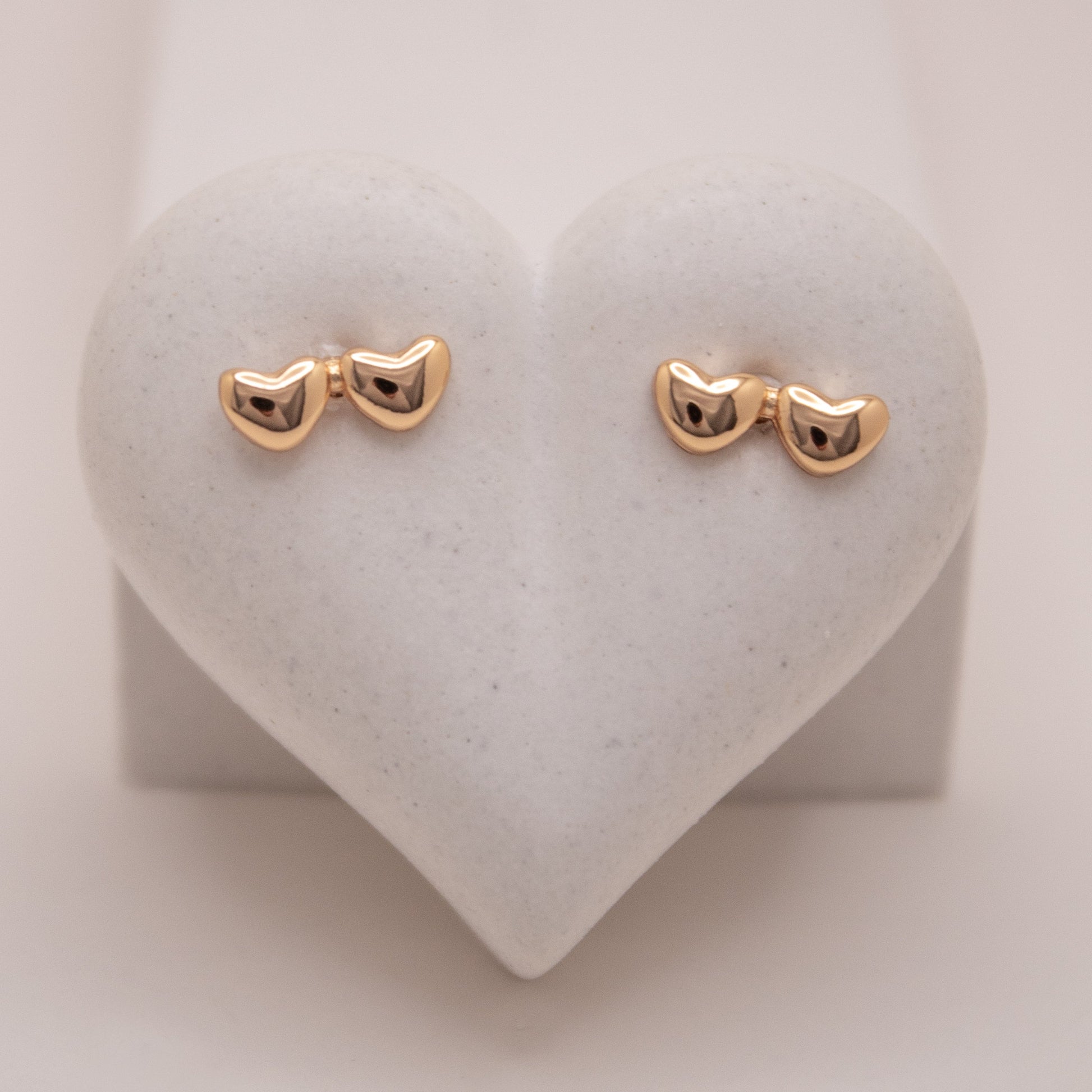 Gold rose stud earrings with double heart design by Selva&Co.