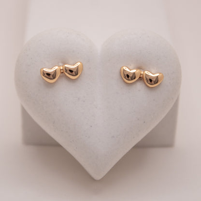 Gold rose stud earrings with double heart design by Selva&Co.