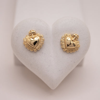Gold heart stud earrings with cross detail