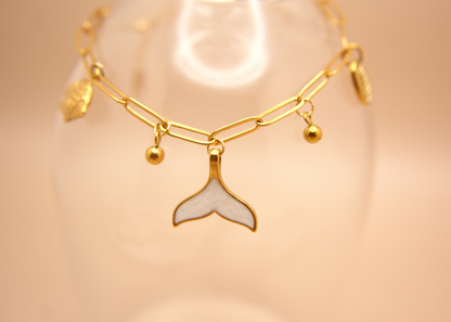 Ocean-inspired Siren’s Whisper Bracelet with mermaid tail pendant and small beads