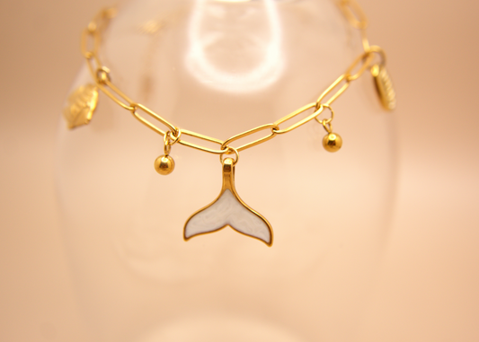 Ocean-inspired Siren’s Whisper Bracelet with mermaid tail pendant and small beads