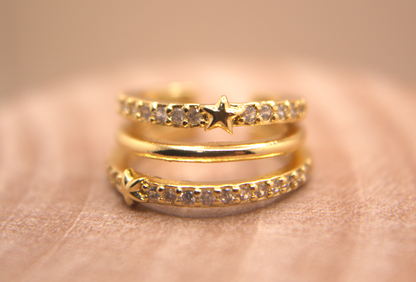 Triple band gold ear cuff, star design with white zirconia crystals, trendy jewelry.