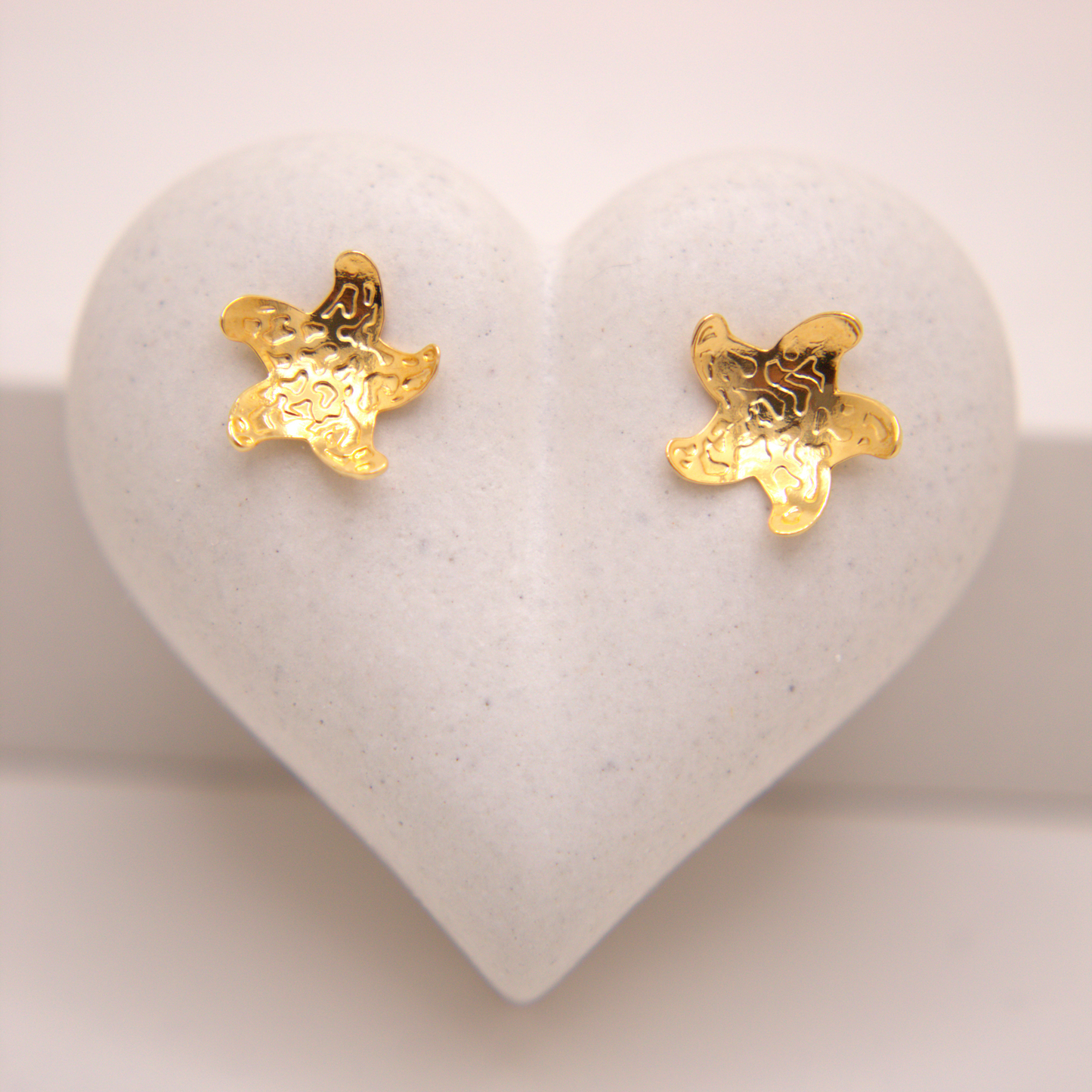 Gold textured starfish stud earrings by Selva&Co.