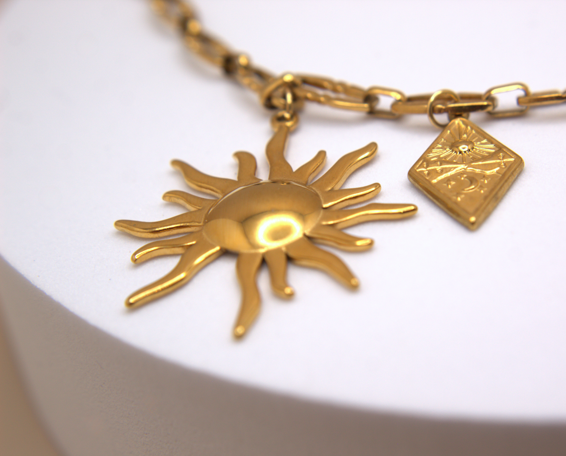 Statement gold necklace featuring multiple sun charms, waterproof stainless steel.