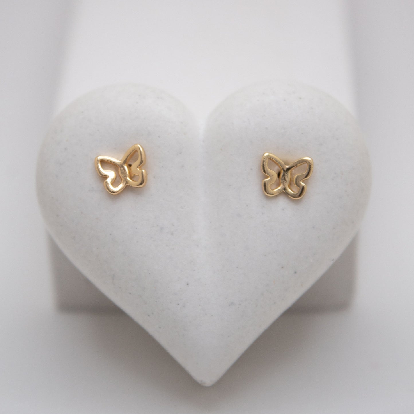Small golden butterfly stud earrings by Selva