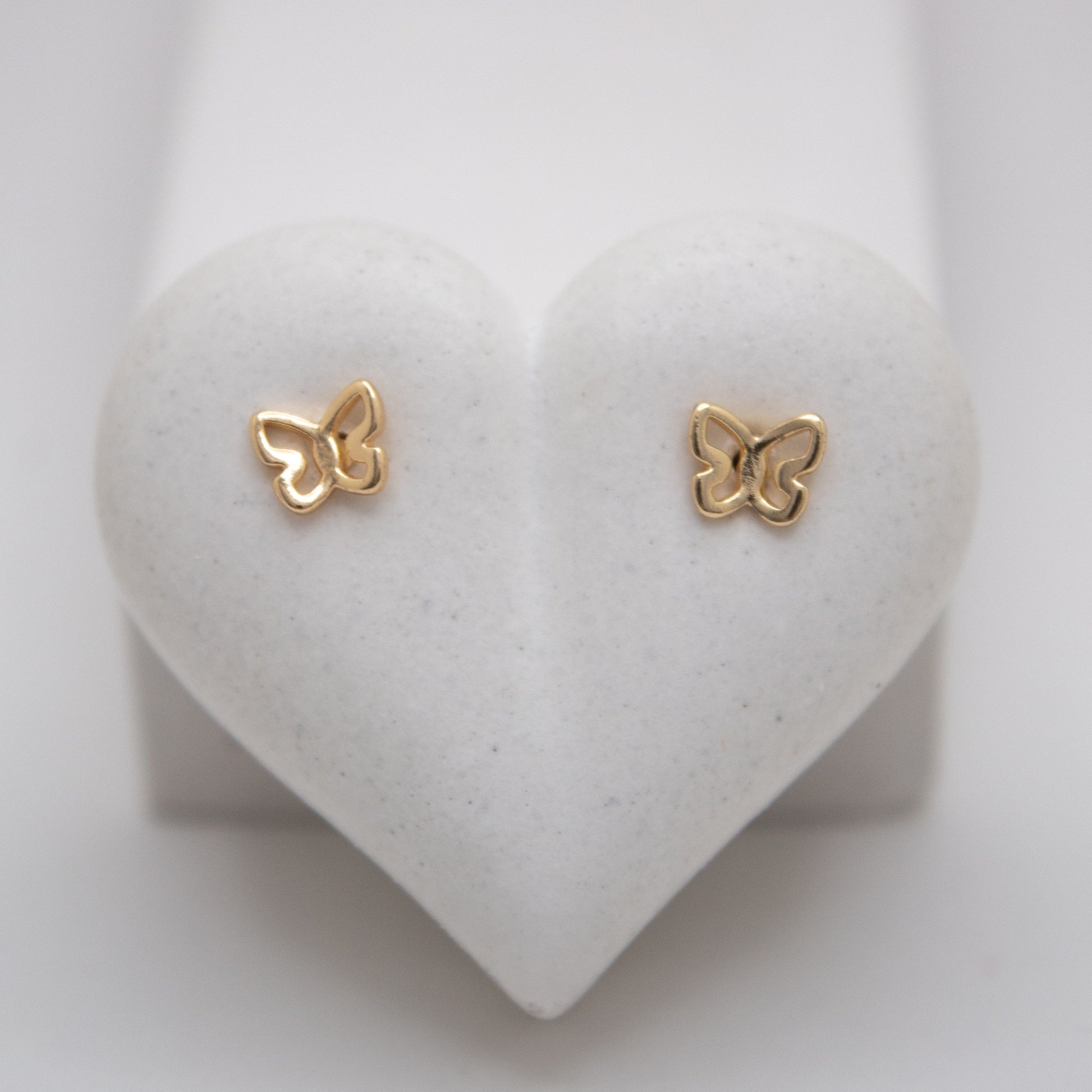 Small golden butterfly stud earrings by Selva