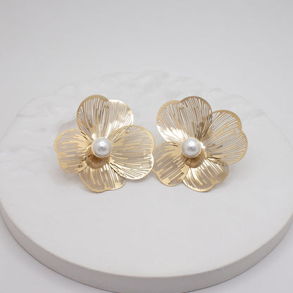 Large gold flower earrings with pearl center