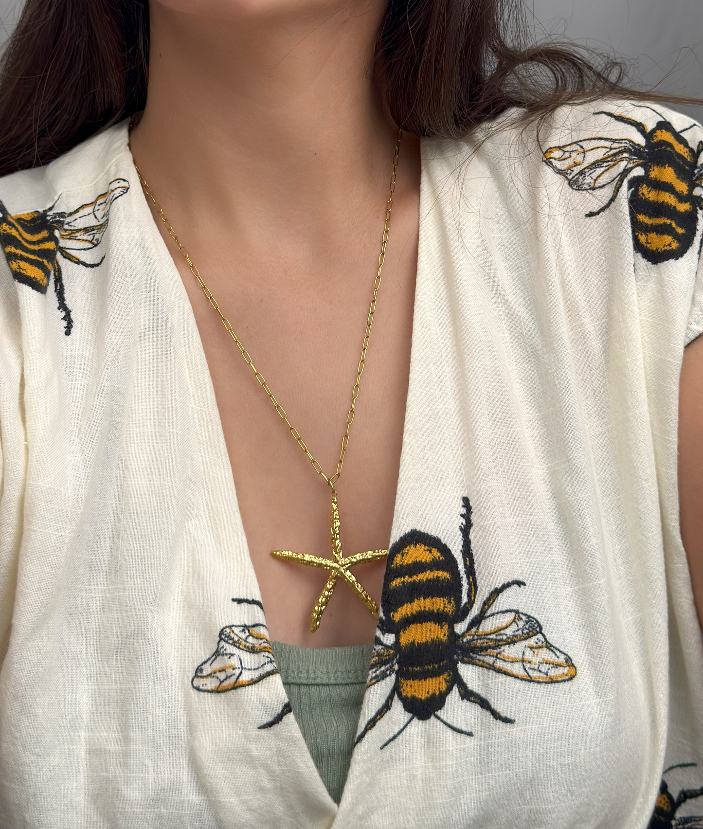 Golden starfish pendant necklace on long chain by Selva Accessories