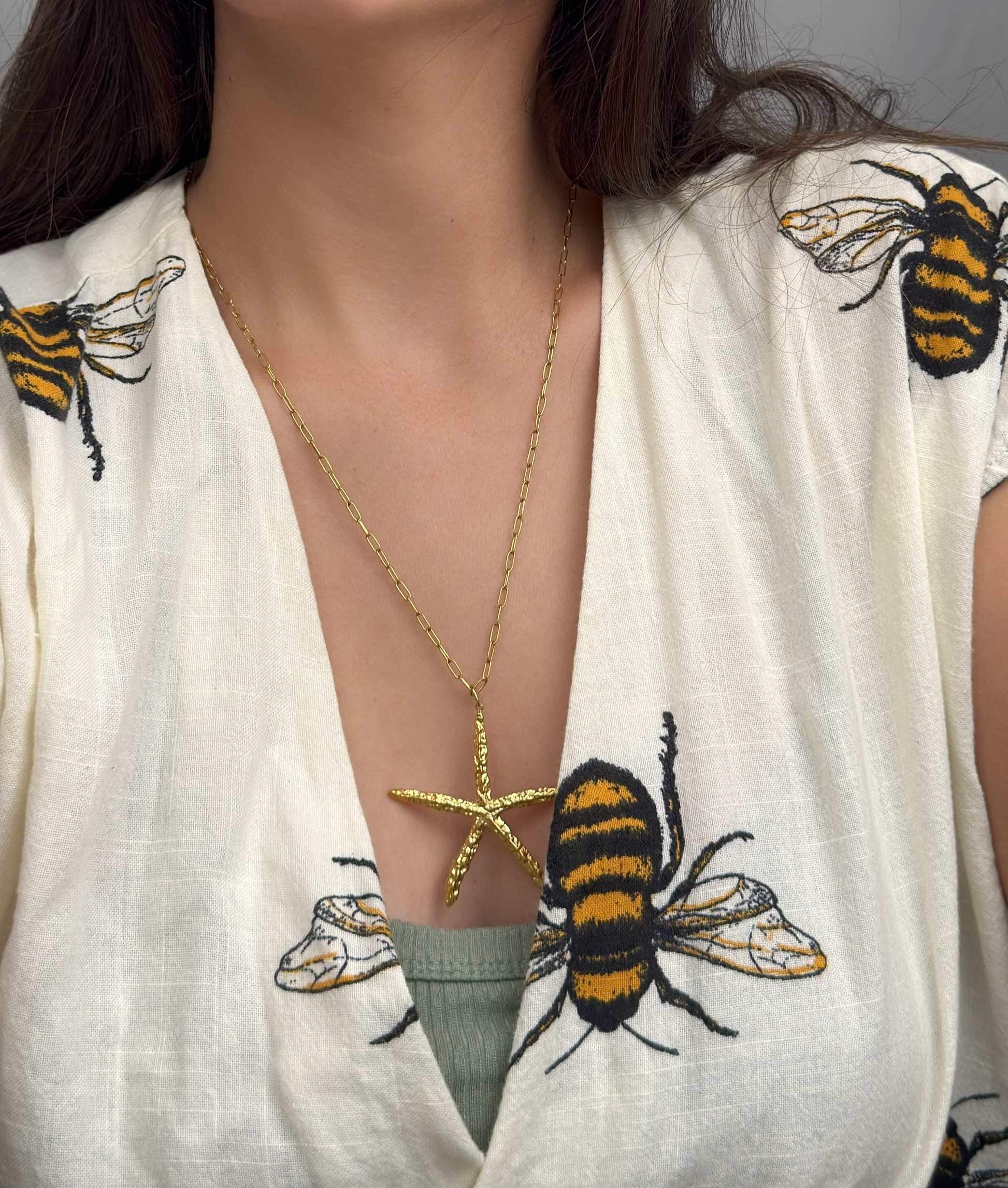 Golden starfish pendant necklace on long chain by Selva Accessories
