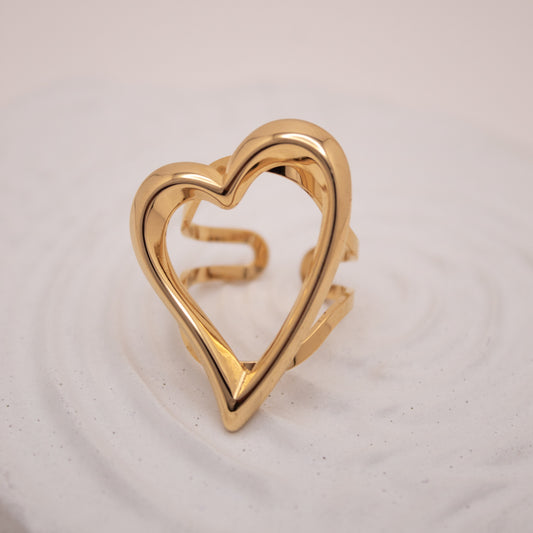 Adjustable gold heart ring with open frame design by Selva&Co.